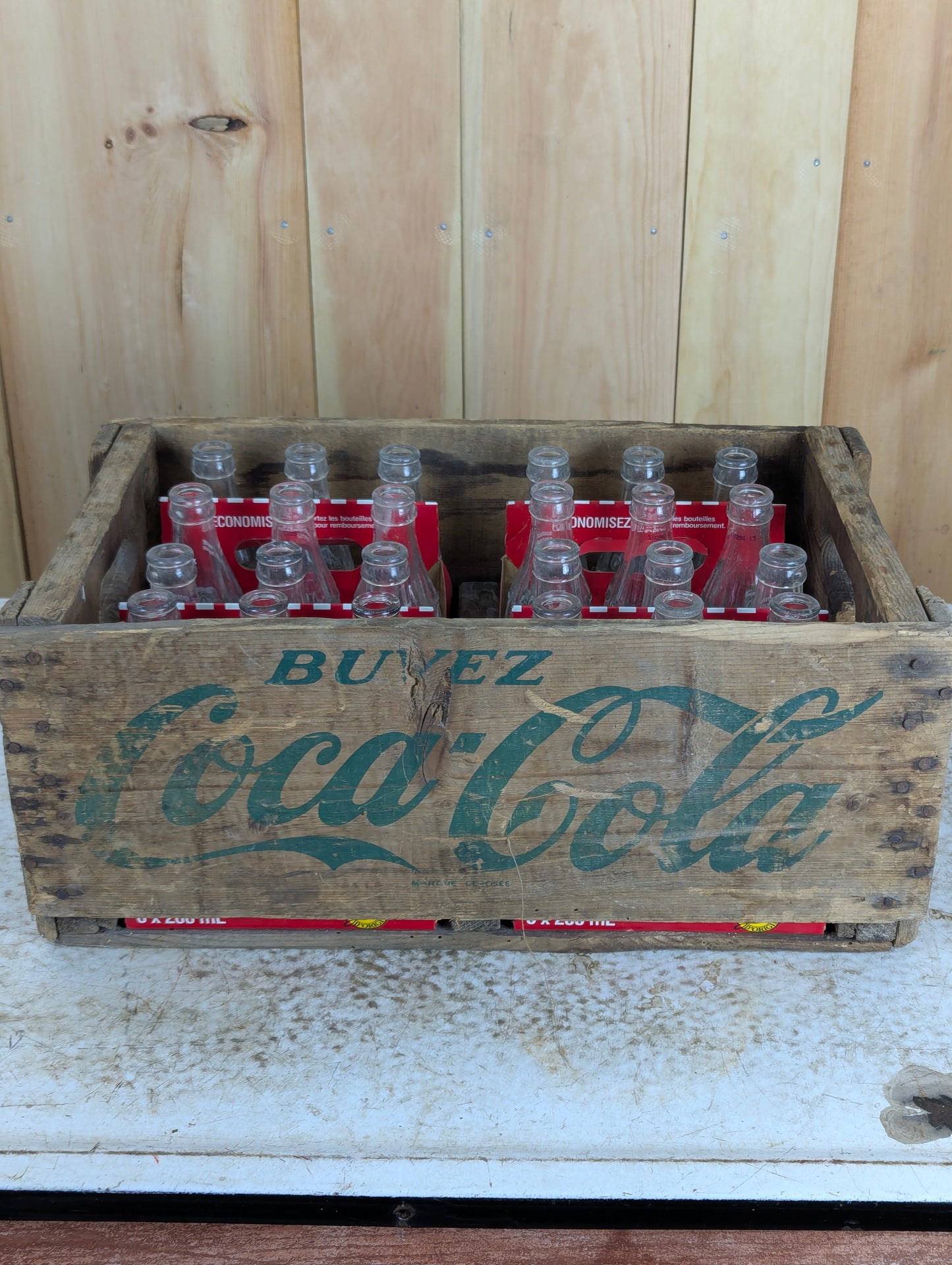 Wooden Coke Crate with 24 Empty Coca Cola Bottles in Cases