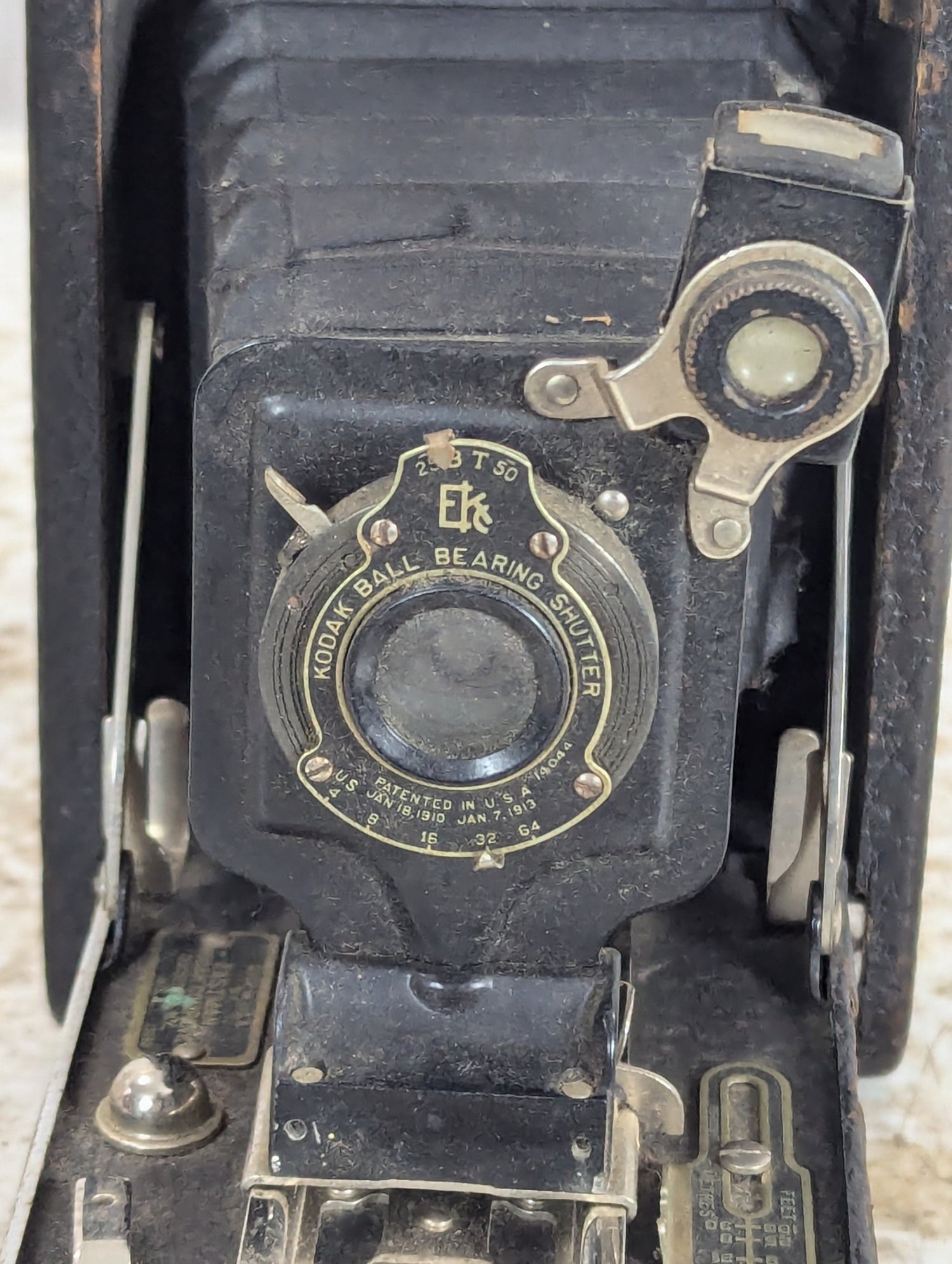 Retro camera gear with vintage film camera, classic lenses, flash and tripod accessories