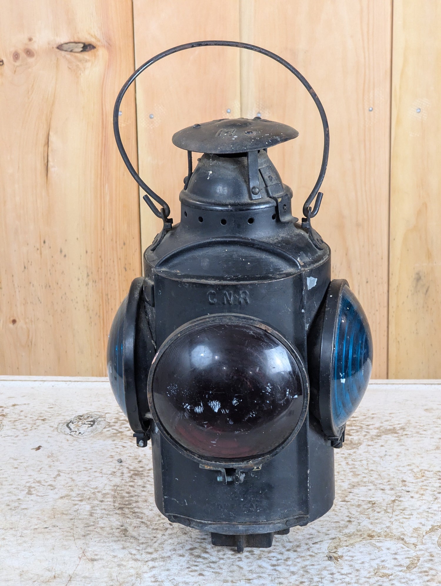 Vintage and antique railroad collectibles including railway lanterns, oil cans, signs, and railway memorabilia