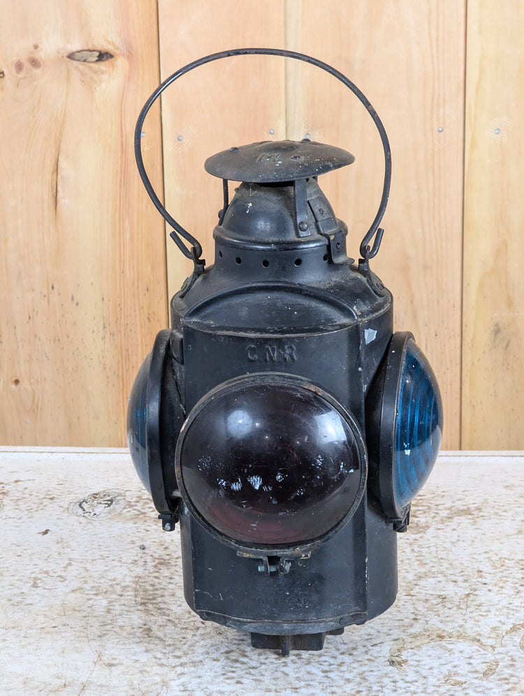 Vintage and antique railroad collectibles including railway lanterns, oil cans, signs, and railway memorabilia