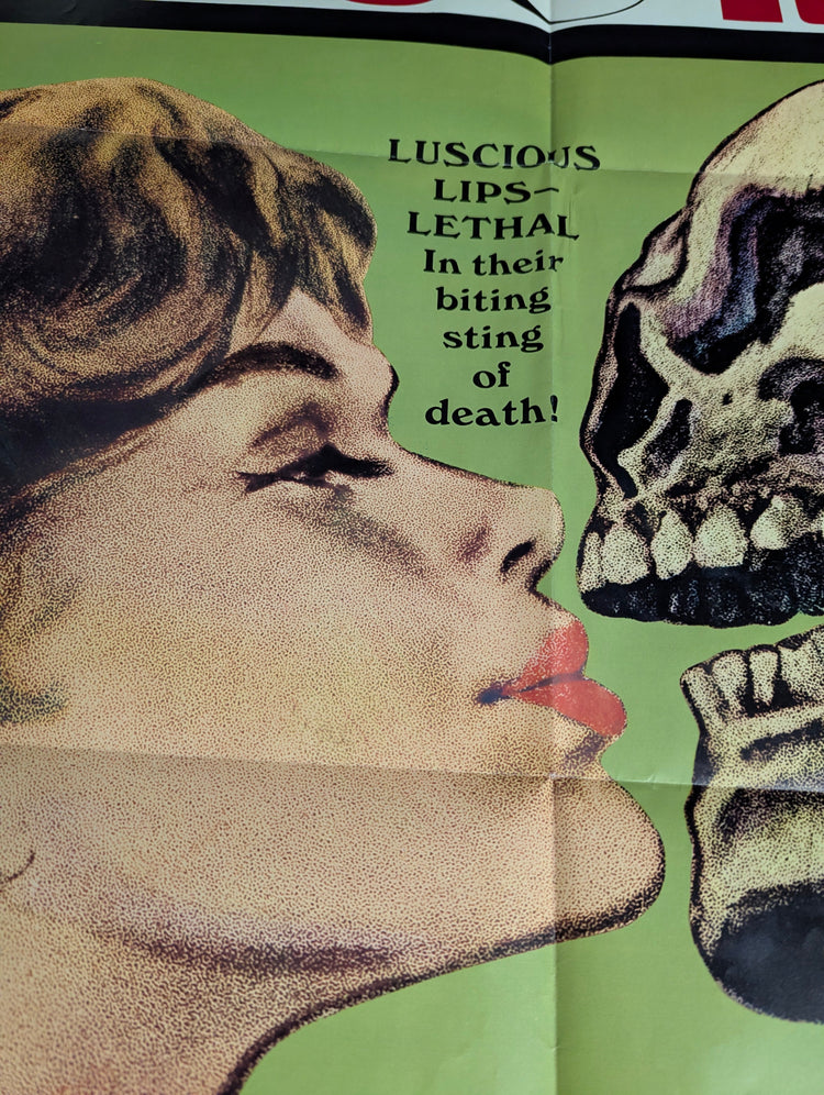 Vintage horror and sci-fi movie posters from 1950s–1980s on wall display