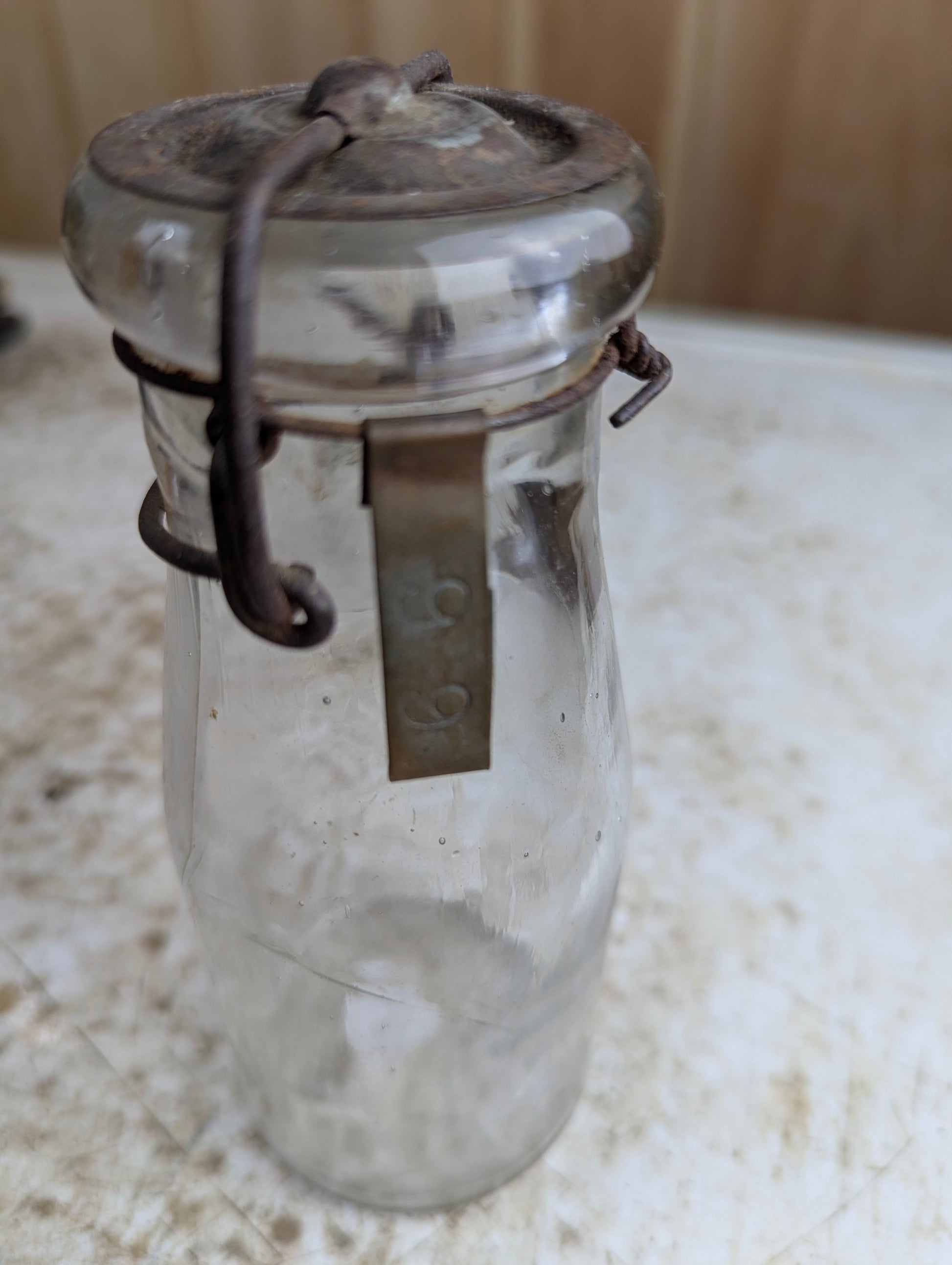 1910s Half Pint Manganese Glass Milk Bottle with Wire Bail Tin Lid
