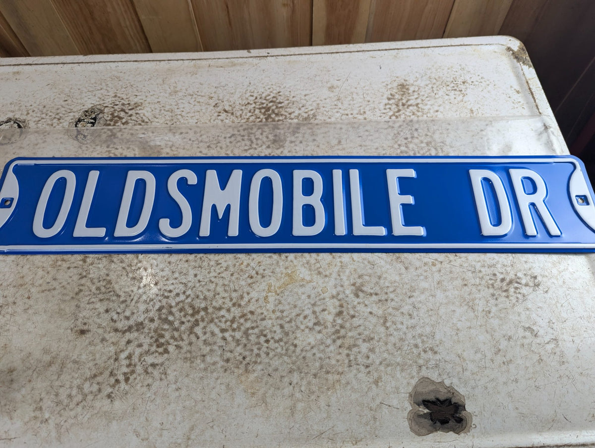 Embossed Powder-Coated Steel 'OLDSMOBILE DR' Novelty Street Sign 32" x 6"