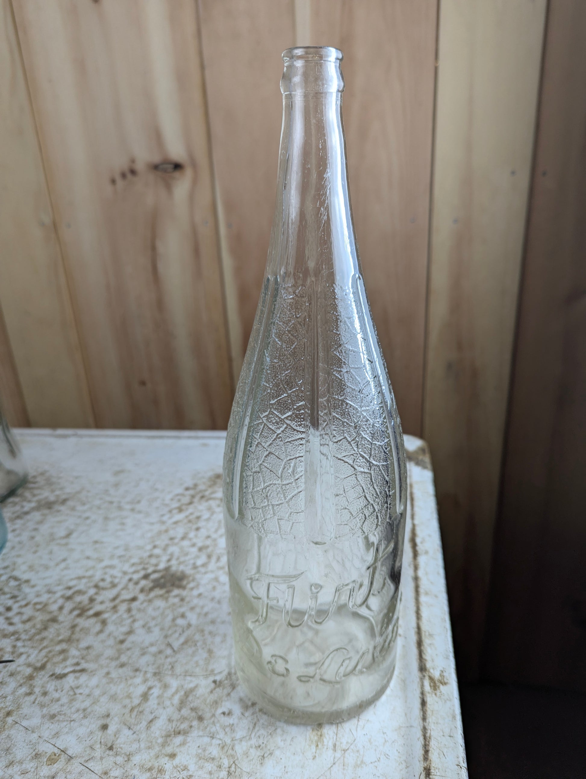 1930s Flirt 'De Luxe' Montreal 48oz Embossed Glass Soda Bottle