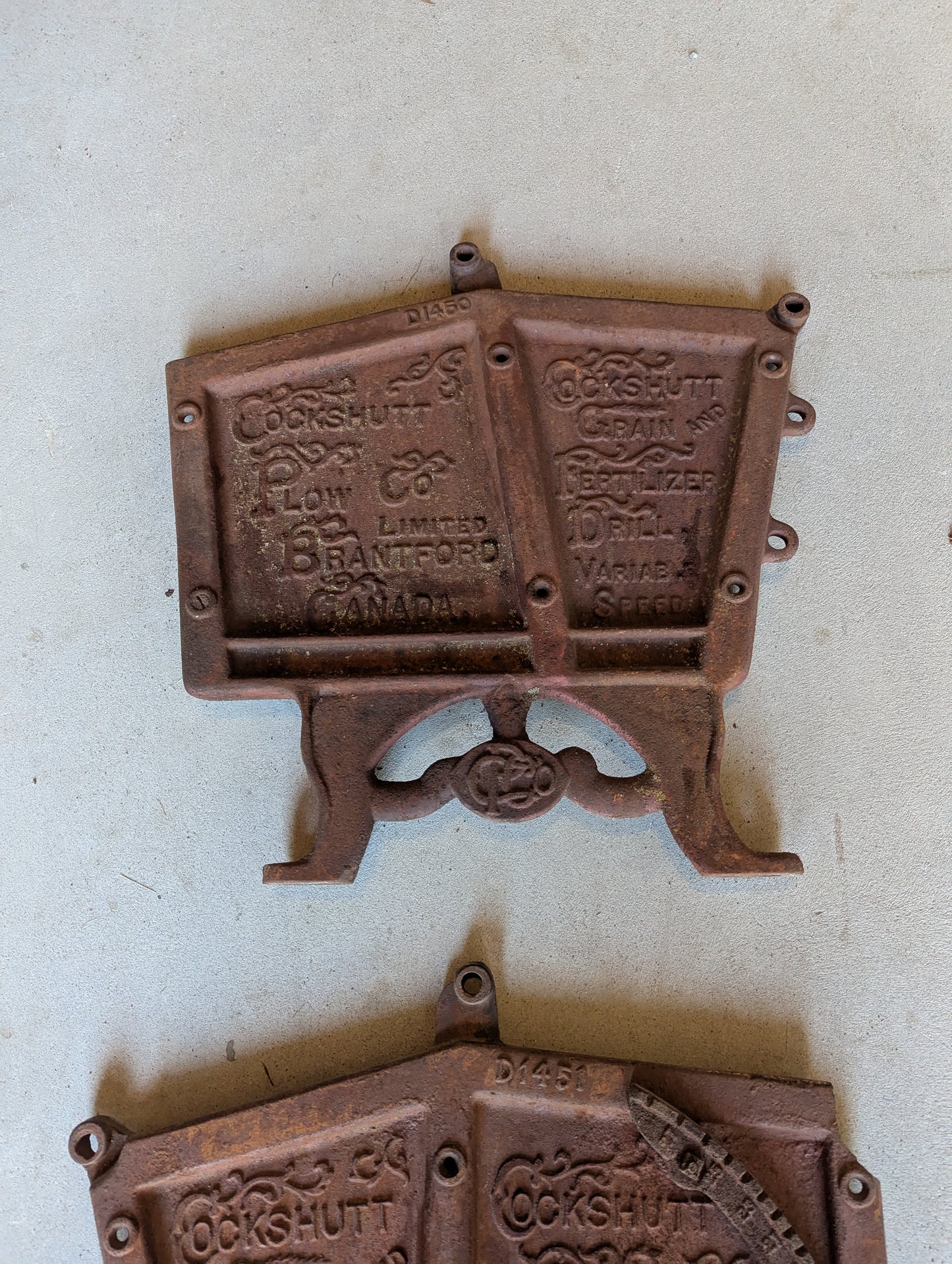 Pair of Cast Iron Cockshutt Plow Co. Branford Ont. Seeder Plates