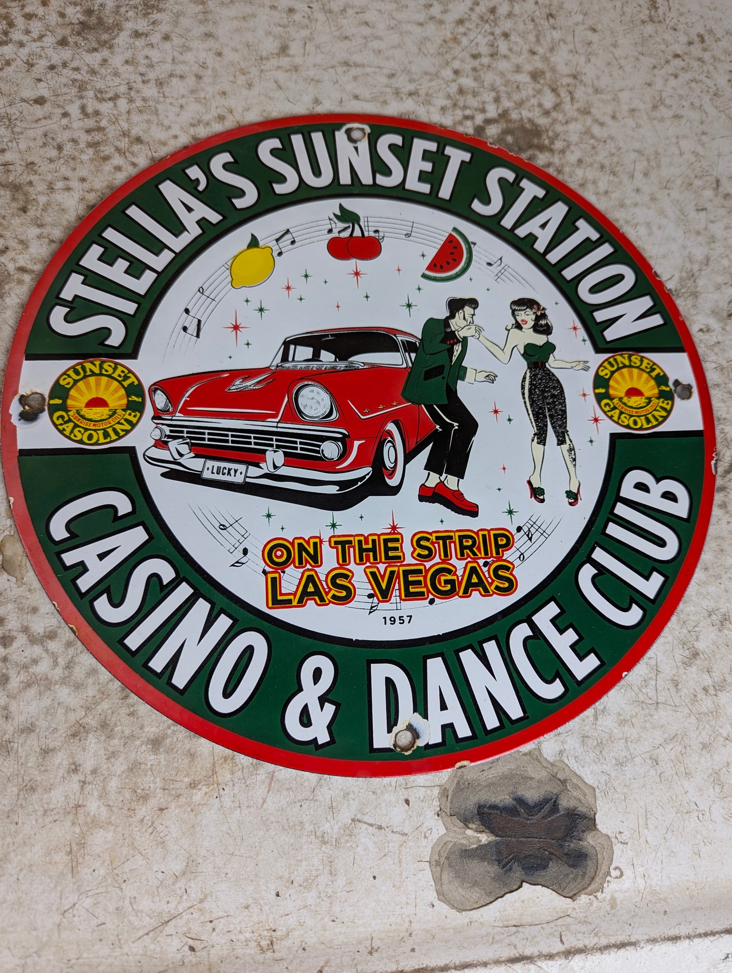 1957 Porcelain 12” Stella’s Sunset Station Gas Station Advertisement