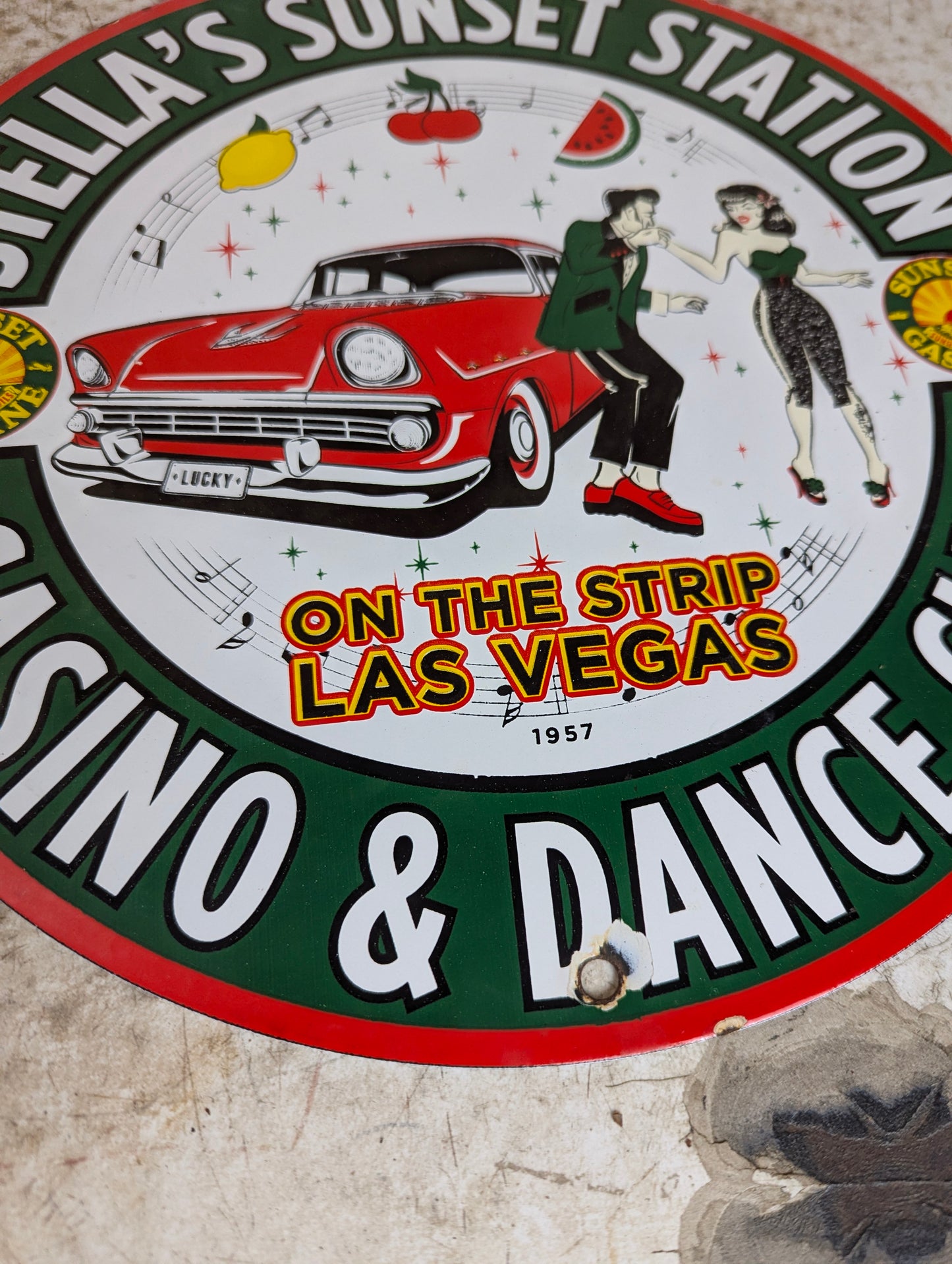 1957 Porcelain 12” Stella’s Sunset Station Gas Station Advertisement