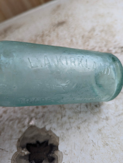 L.A. Kirkland Toronto Antique Embossed Aqua Blue Glass Soda Bottle