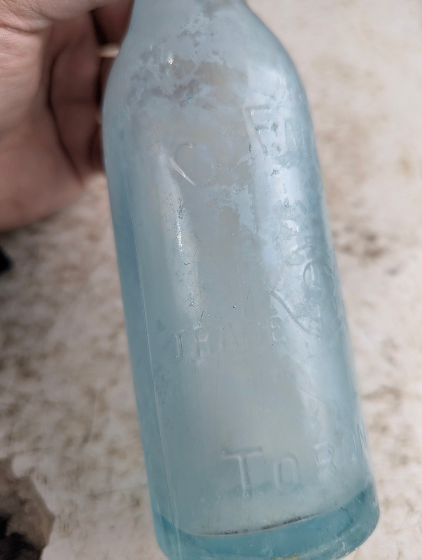 C Feuman Toronto Antique Embossed Aqua Blue Glass Soda Bottle