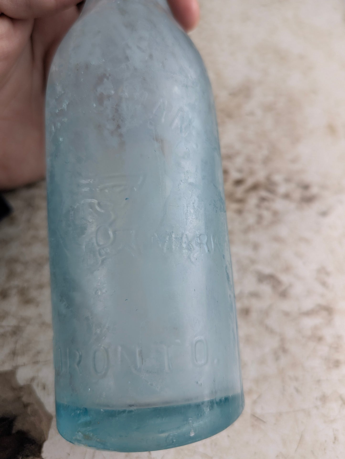 C Feuman Toronto Antique Embossed Aqua Blue Glass Soda Bottle