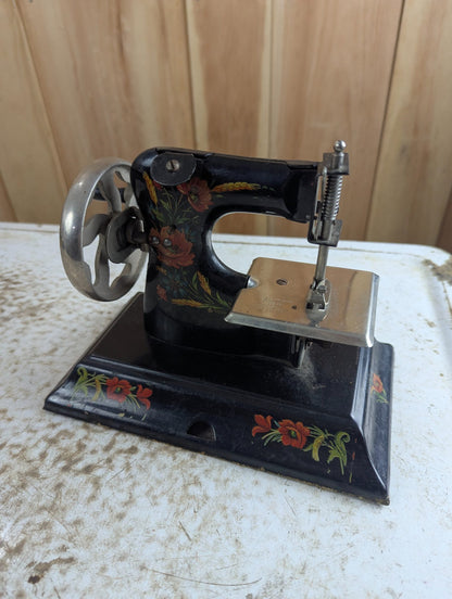1920s Casige Metal Toy Sewing Machine with Floral Decals
