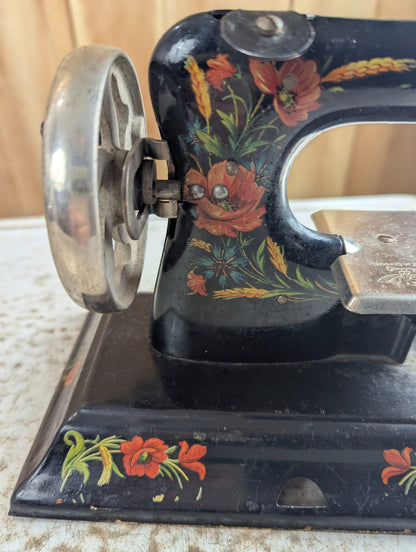 1920s Casige Metal Toy Sewing Machine with Floral Decals
