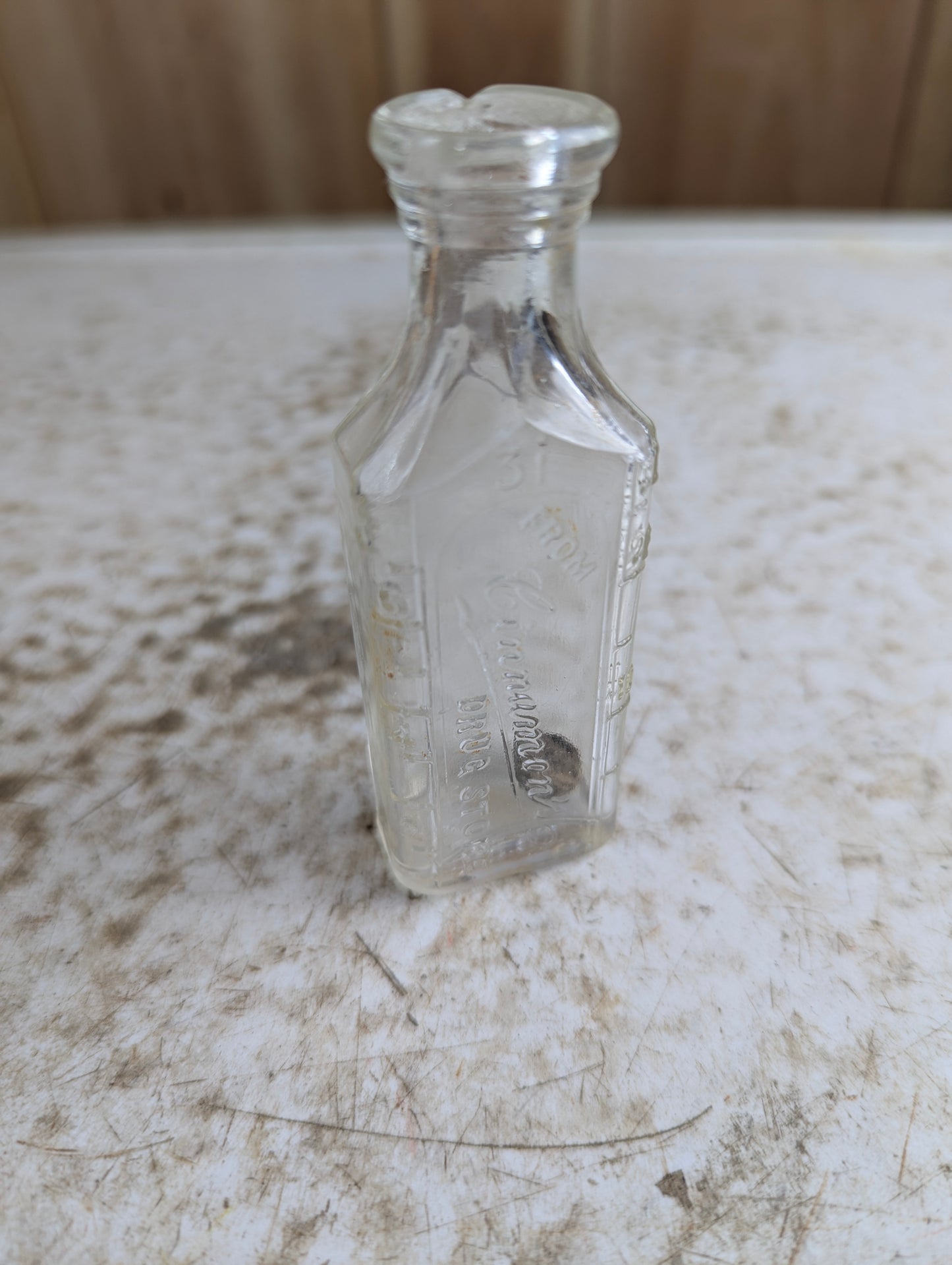 Antique Cinnamon's Drug Store Embossed Clear Glass Apothecary Medicine Bottle