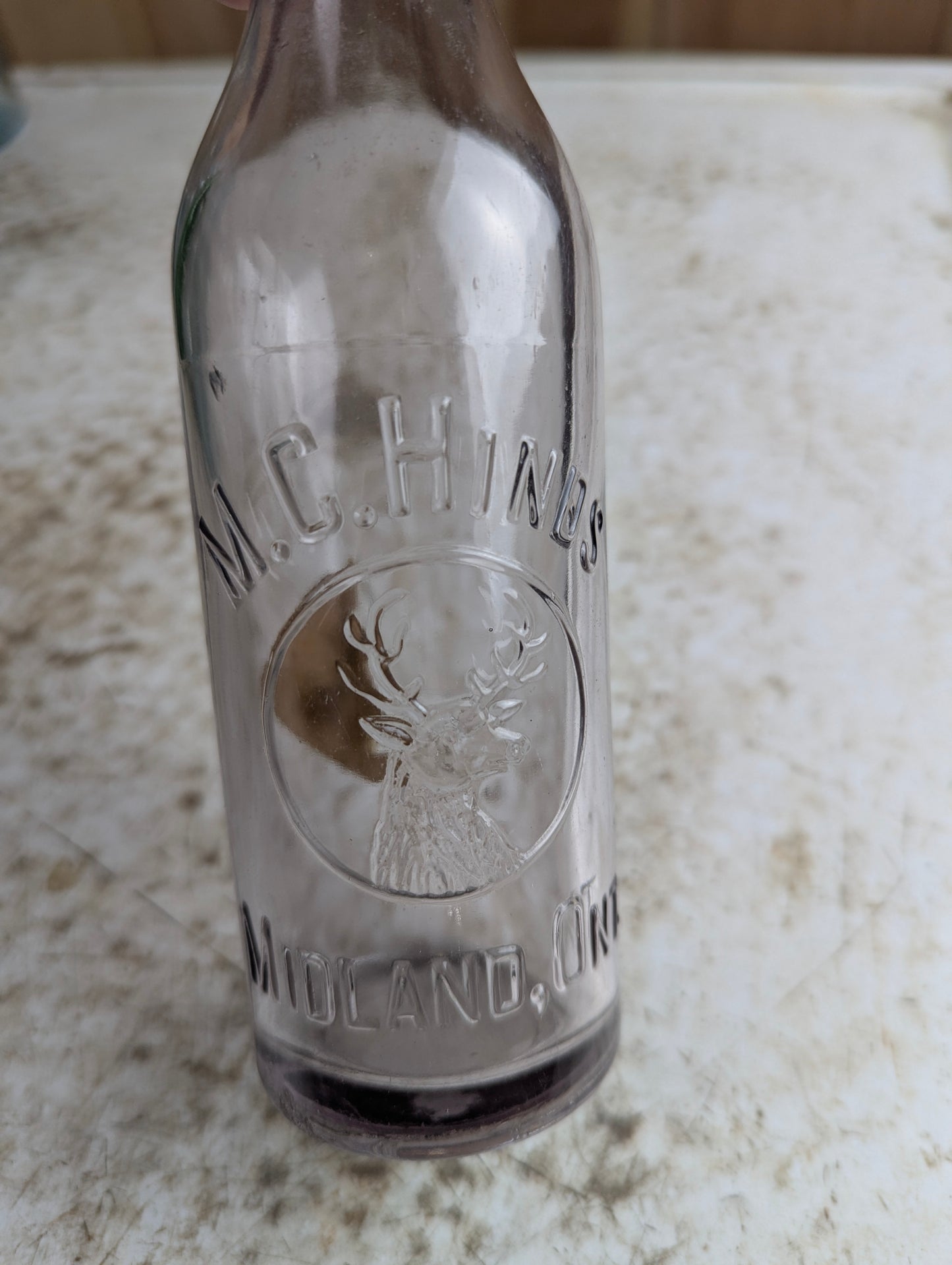 Antique M.C. Hinds Midland Amethyst Manganese Glass Embossed Soda Bottle - view 2