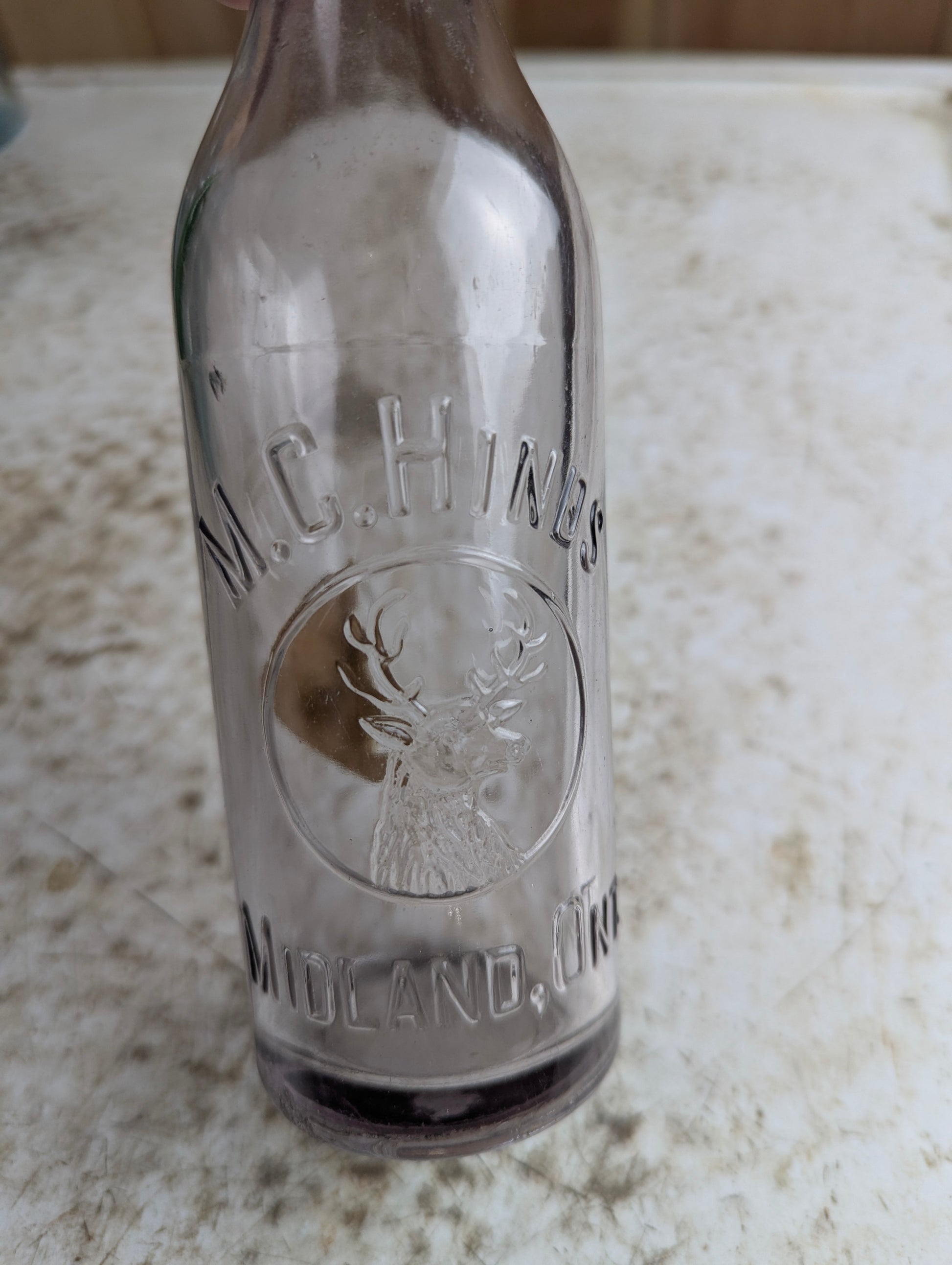 Antique M.C. Hinds Midland Amethyst Manganese Glass Embossed Soda Bottle - view 2