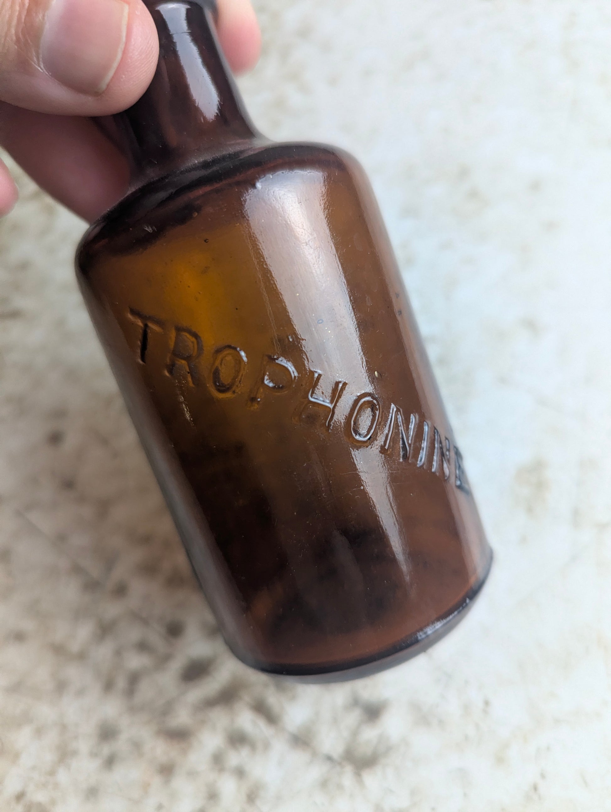 Antique Trophonine Reed & Carnrick Embossed Amber Glass Patent Medicine Bottle - view 3