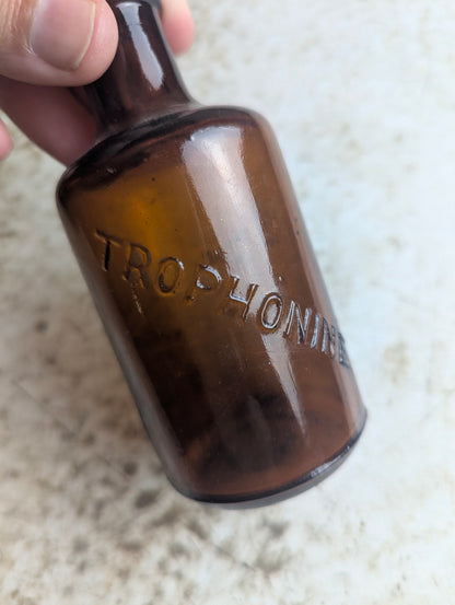 Antique Trophonine Reed & Carnrick Embossed Amber Glass Patent Medicine Bottle - view 3