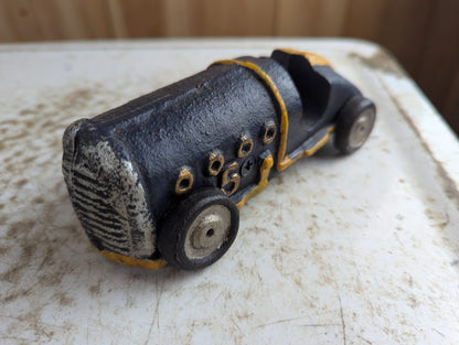 Vintage Cast Iron Race Car Toy with Yellow Stripe - Black