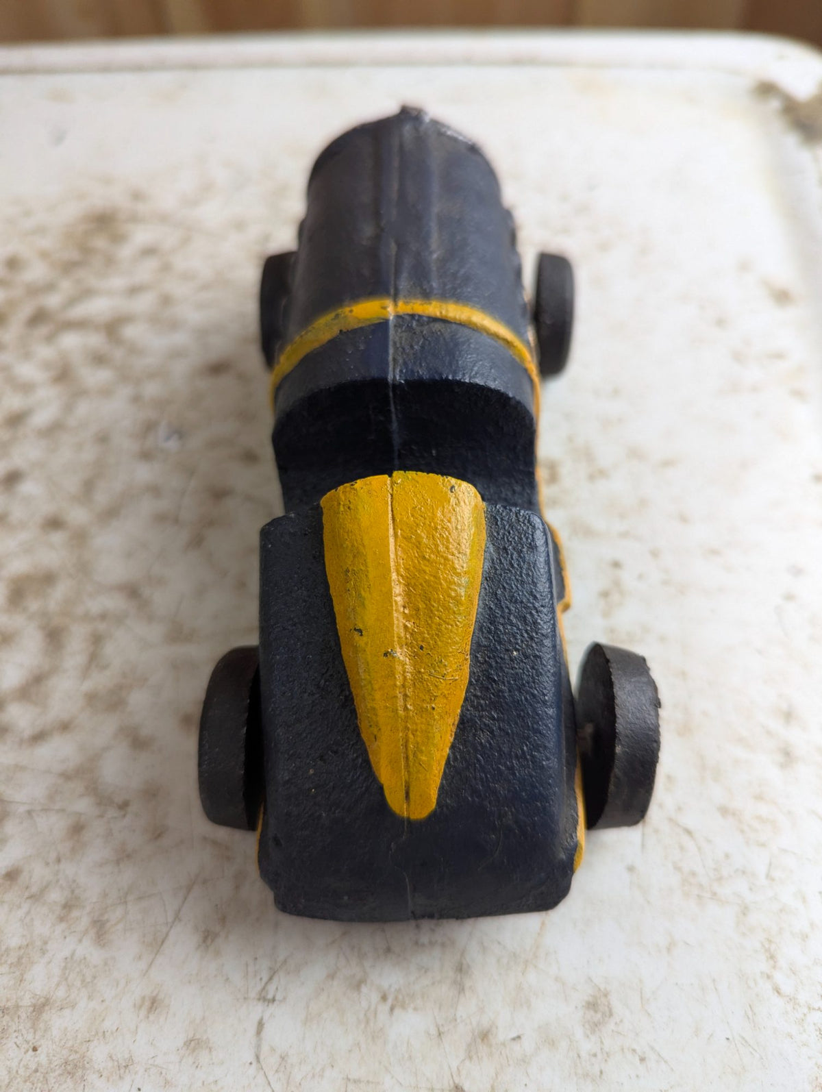 Vintage Cast Iron Race Car Toy with Yellow Stripe - Black