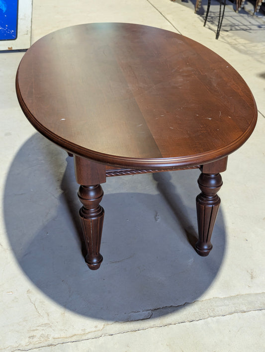 Vintage dark wood oval coffee table with fluted legs