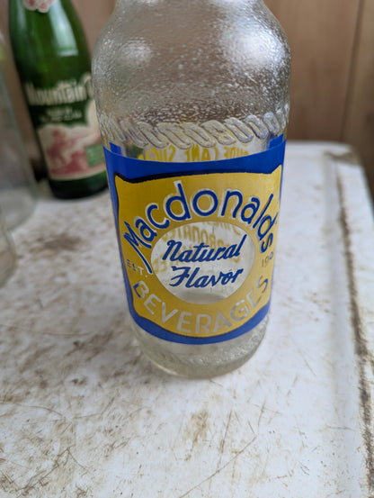 Vintage Macdonald's Beverages Steinie Size Blue and Yellow ACL Soda Bottle - view 2
