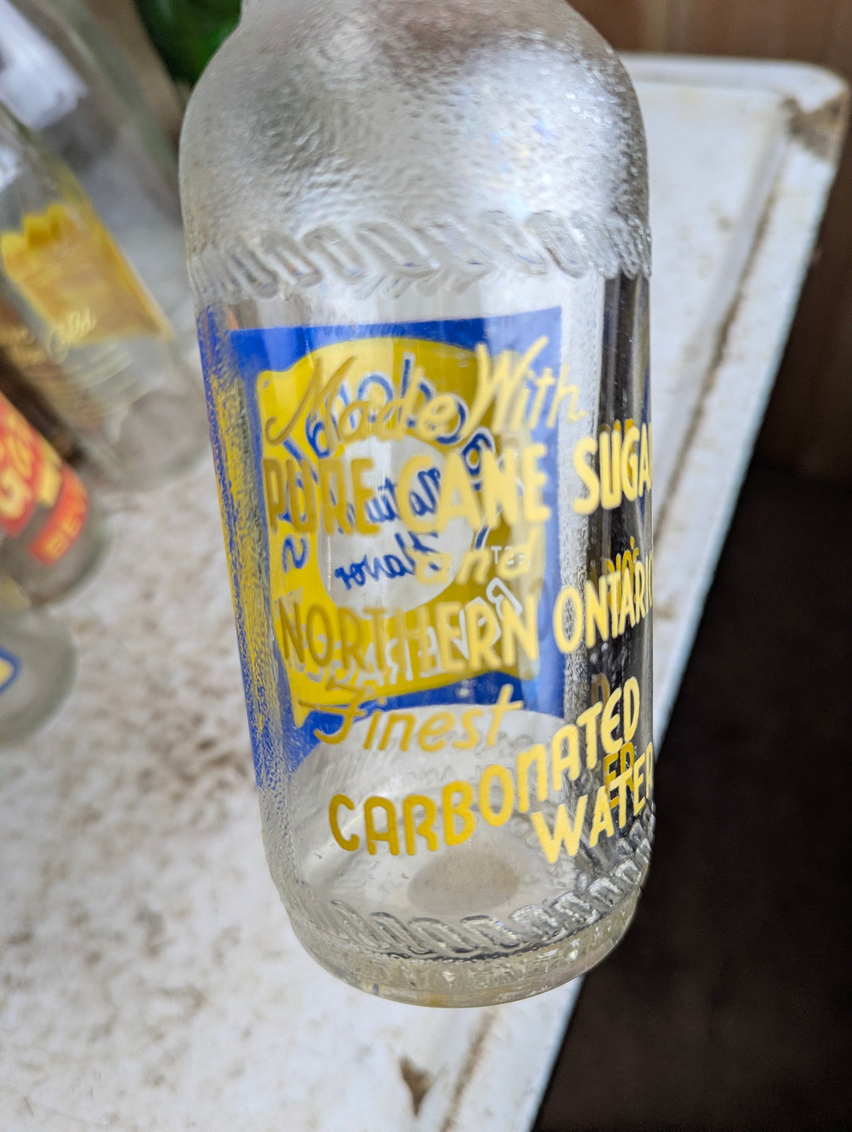 Vintage Macdonald's Beverages Steinie Size Blue and Yellow ACL Soda Bottle - view 3