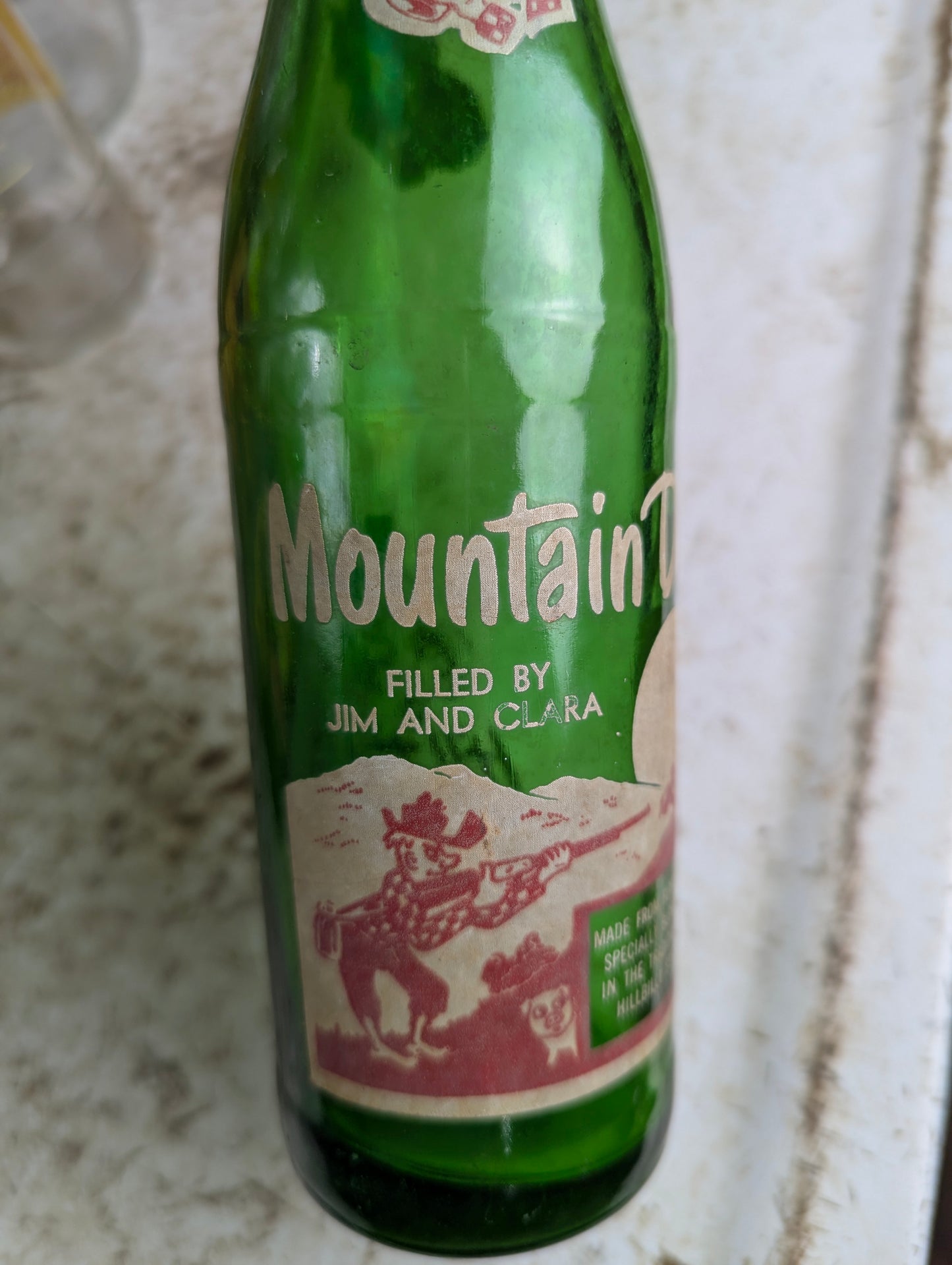Vintage Mountain Dew 10oz Hillbilly 'Filled by Jim and Clara'  Green Glass ACL Soda Bottle - view 2