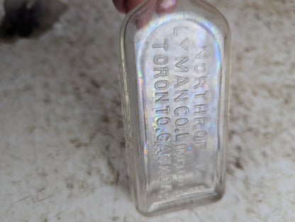 Vintage Northrop and Lyman S.N. Thomas Eclectric Oil Clear Glass Patent Medicine Bottle - view 2