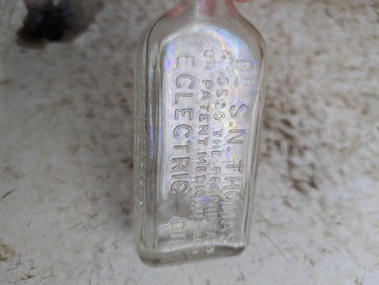 Vintage Northrop and Lyman S.N. Thomas Eclectric Oil Clear Glass Patent Medicine Bottle - view 3
